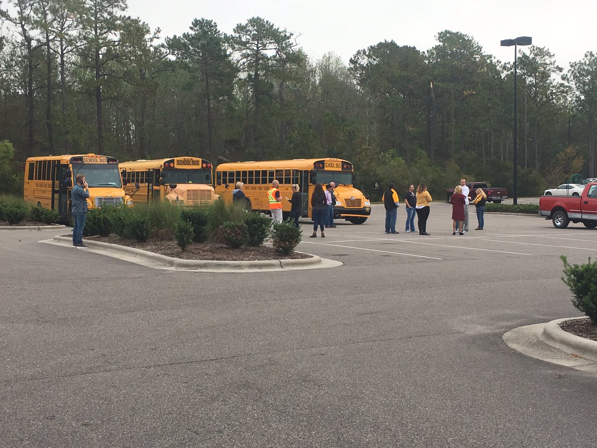 Buses that were still in route to Topsail High School, Middle School, and Elementary School are pulling into the Hampstead Lowe's foods parking lot where parents are able to pick up these students with proper ID.  