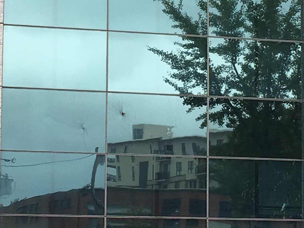 Someone with a handgun shoots up federal building in downtown Asheville after shooting a man outside Scandal's nightclub 2am this morning.