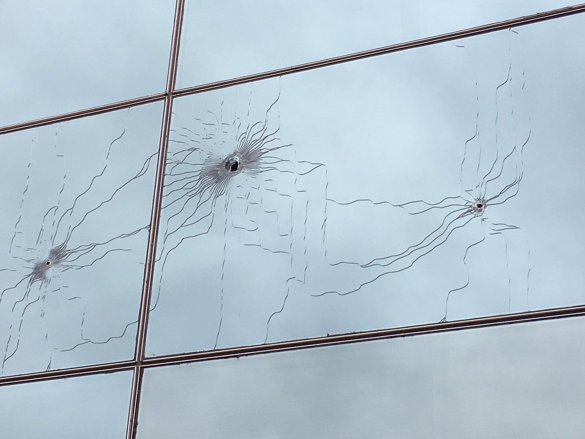 Someone with a handgun shoots up federal building in downtown Asheville after shooting a man outside Scandal's nightclub 2am this morning.