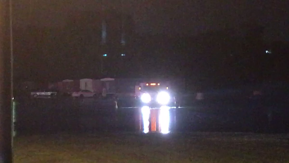 Flooding on John Price Rd in South Charlotte. Emergency crews brought out in boats to check on people. Some people are outside – standing by or sitting in their cars, walking through water