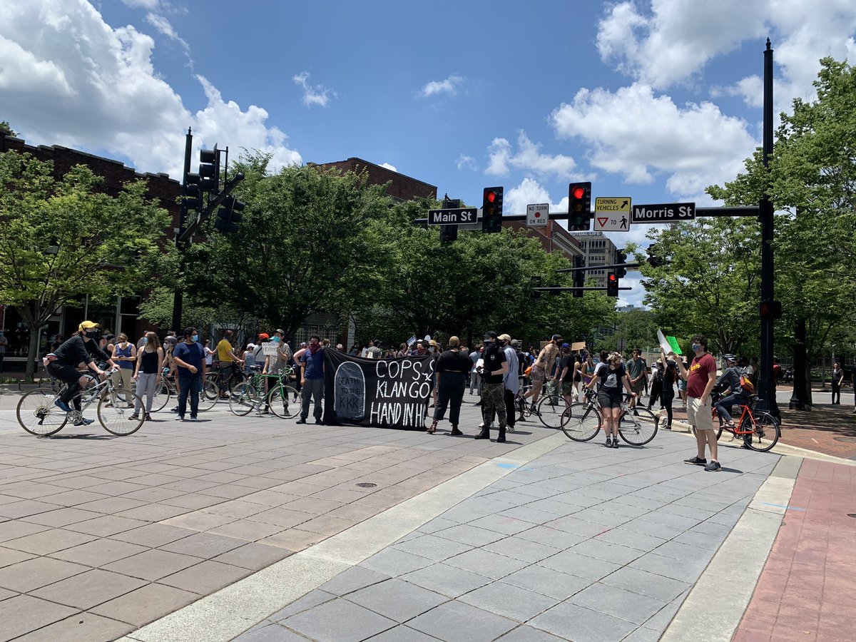 Group is blocking off Main & Morris St. Police are circling the area
