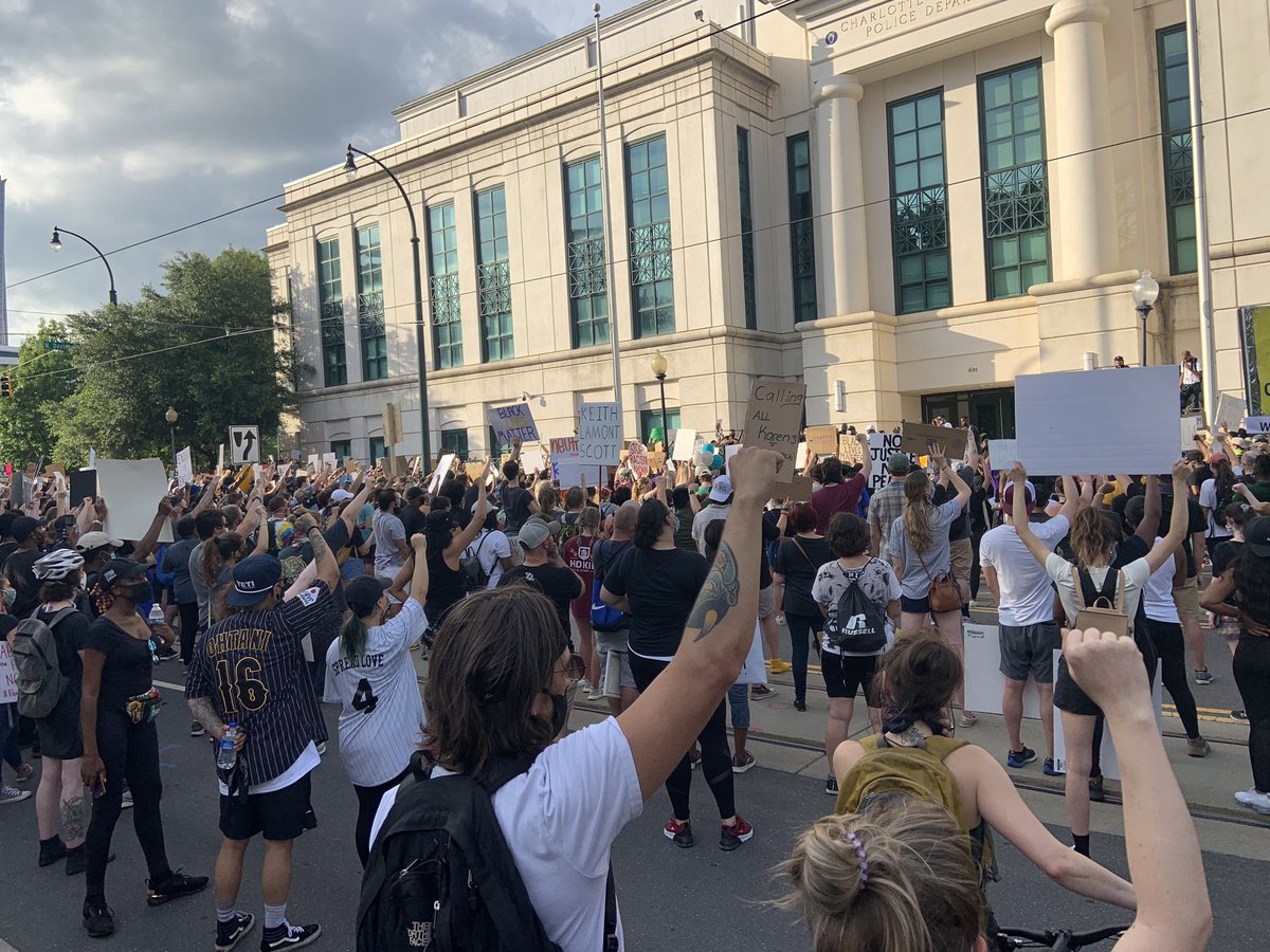 With fists raise they're   reading out the names of those who died at the hands of police