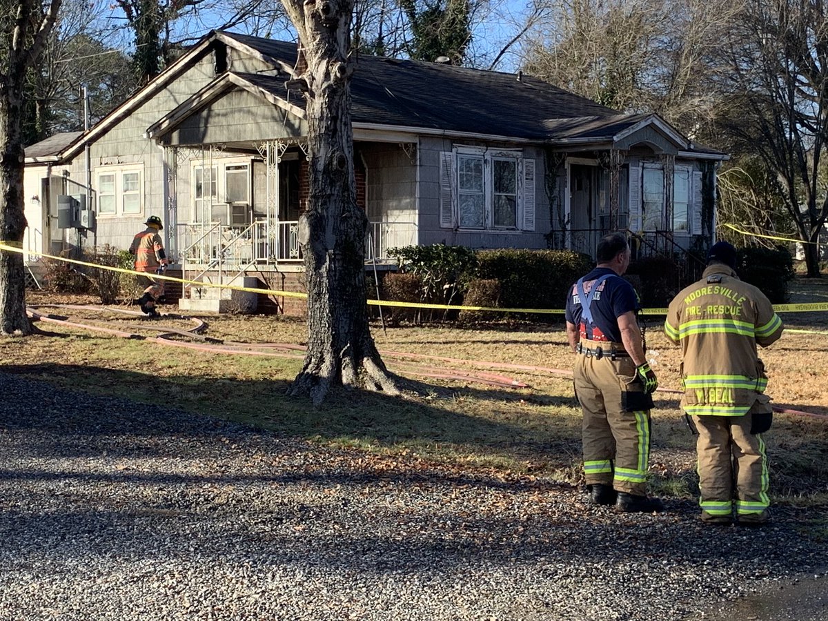 Scene of a house fire just outside downtown Mooresville. Neighbors say flames could be seen shooting out of the windows and roof