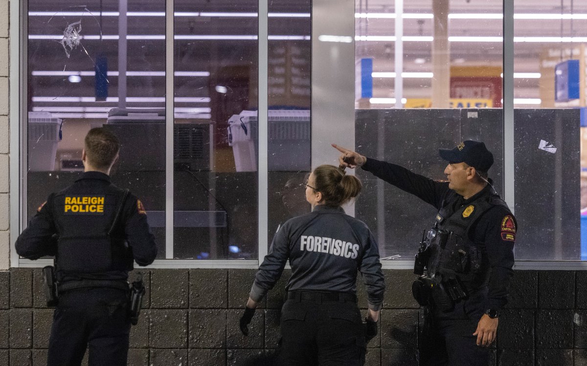 Police are investigating a shooting at the Raleigh Boulevard Shopping Center that occurred around 9 p.m. Monday. At least 50 evidence cones were in the parking lot and at least three bullet holes in the front windows of a Food Lion. Reports of injuries