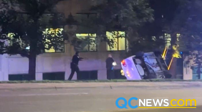 Queen City News captured the moment police drew guns on a flipped-over vehicle full of people Tuesday night on Wilkinson Blvd