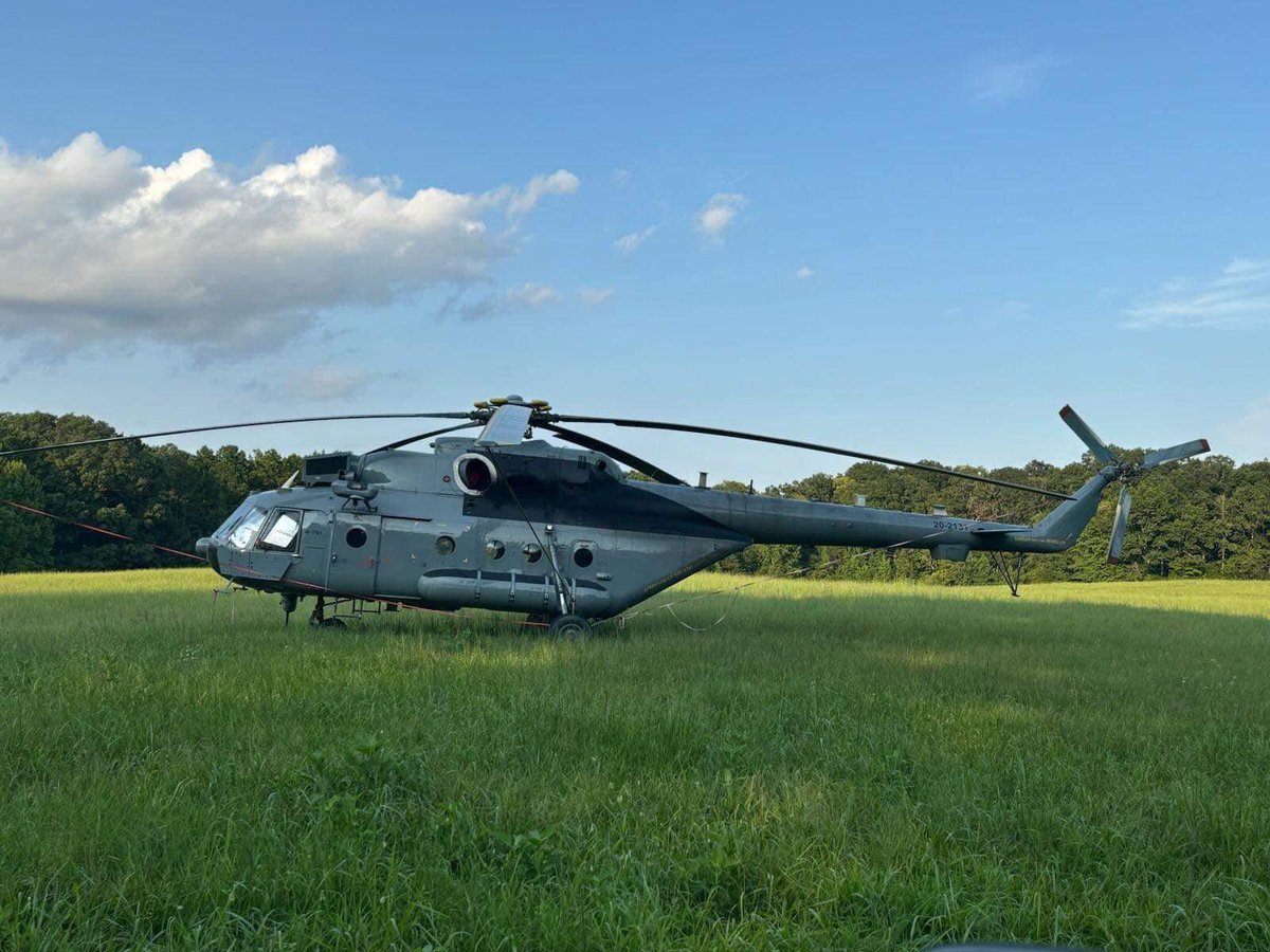 A  Soviet-era transport helicopter unexpectedly landed in a field in Eldorado, North Carolina. Several men with backpacks disembarked and headed into the nearby woods, leaving the Mi-171E1 (20-2131) behind overnight