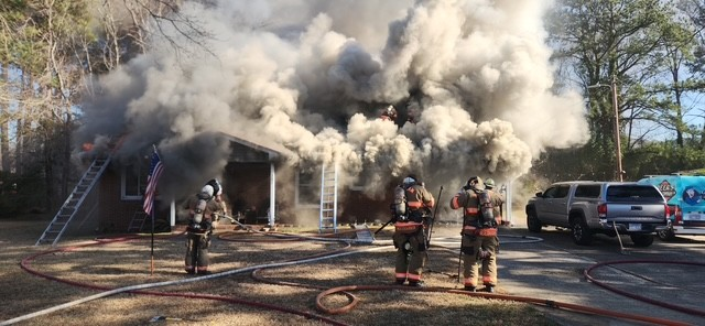 A fire at a home in Durham Tuesday afternoon prompted a response from about 40 firefighters, officials said
