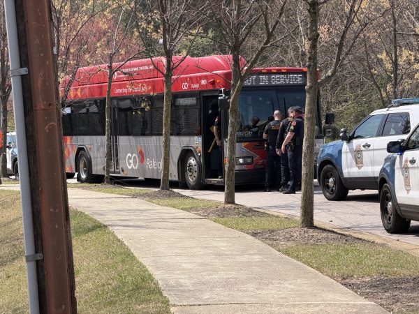 Four people are at large after a fight on a bus led to a gun being fired in Raleigh late Friday morning, police said.