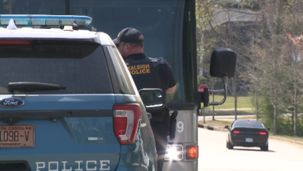 Four people are at large after a fight on a bus led to a gun being fired in Raleigh late Friday morning, police said.